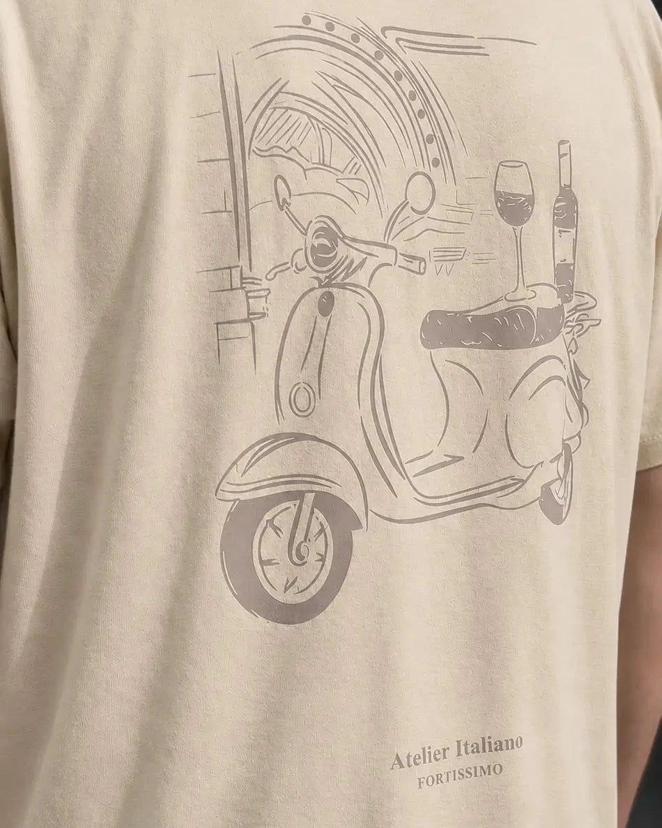 Beige t-shirt with a scooter graphic and text on a person wearing it.