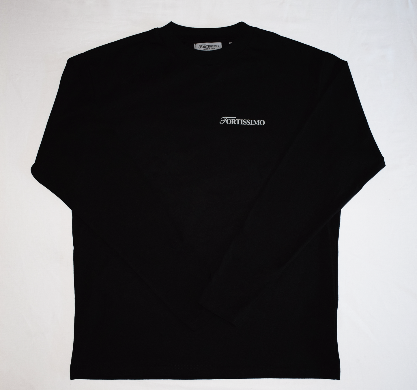 Showing the front of the black Venezia Longsleeve, with the Fortissimo logo in white on the front. 